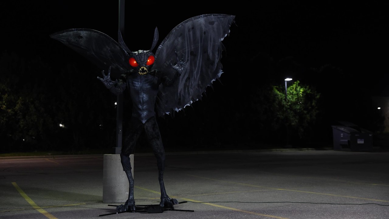 Looming at a monstrous 11.5 feet tall, this Mothman Animated Decoration brings the legendary cryptid to life with glowing red eyes, flapping wings, and spine-chilling sound effects. A towering terror for your Halloween haunt.